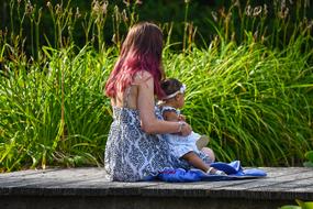 Woman and child green grass