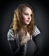 pensive girl in a plaid shirt