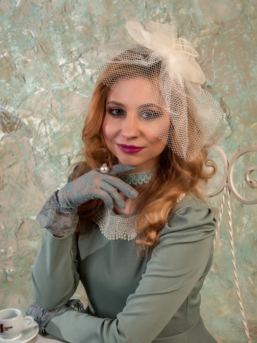 portrait of lovely woman in vintage clothes with Veil on head