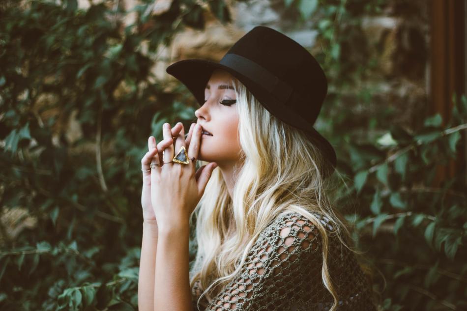 attractive blonde woman in black hat
