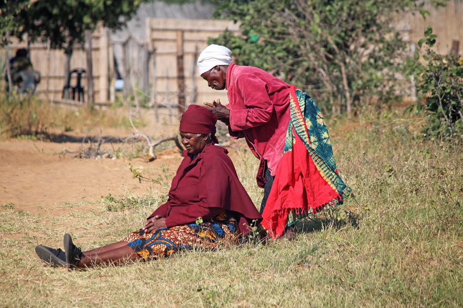 African woman arranging headdress