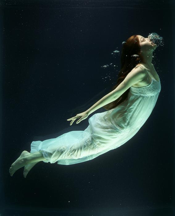 young Woman in long gown Underwater