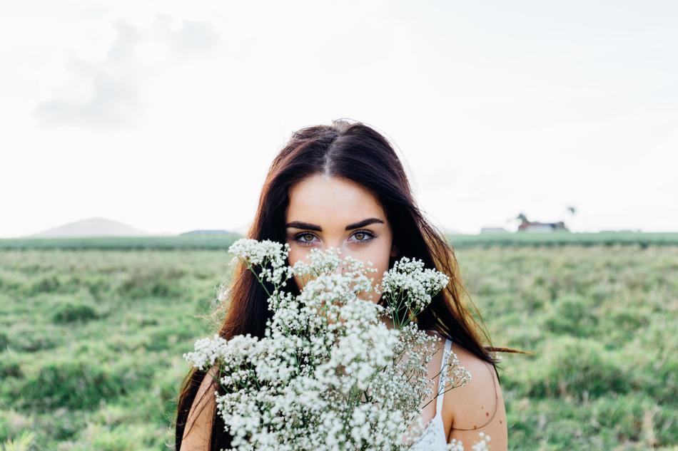 brunette with flowers outdoor