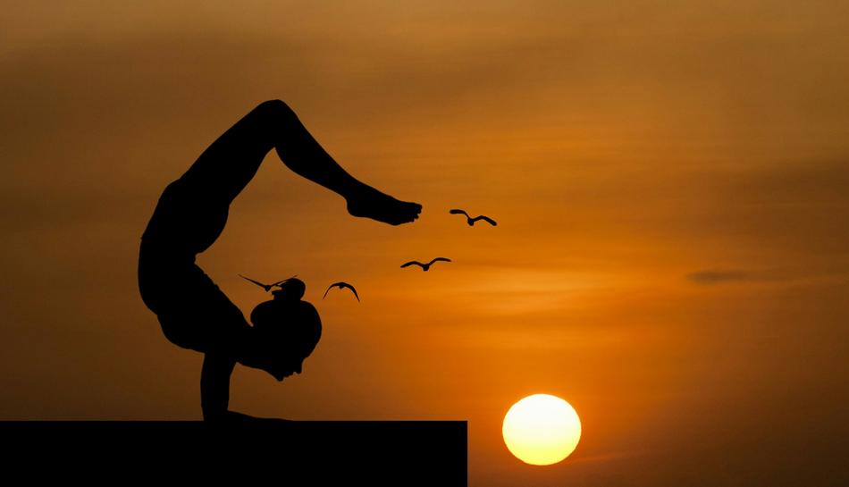Girl in Yoga Balance at the sunset