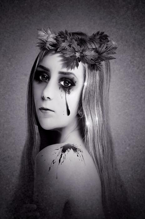 Black and white portrait of the woman with decorations and plants
