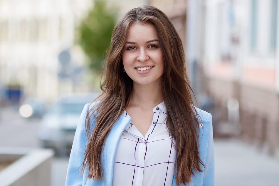 photo of a beautiful brunette in a blue jacket
