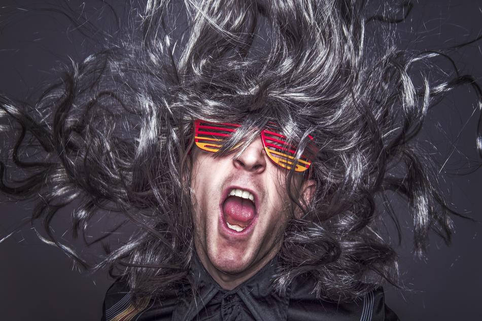 rock star in wig and glasses