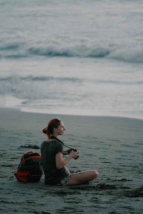 woman with camera on the beach in bali