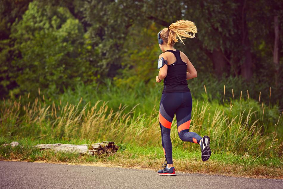 photo of Woman Running on road