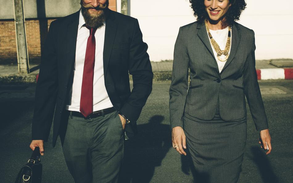 Businessmand and woman Walking