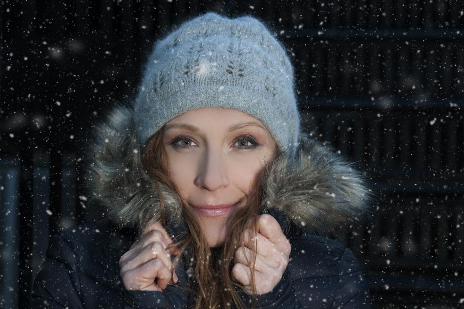 Portrait of the caucasian woman in the snow