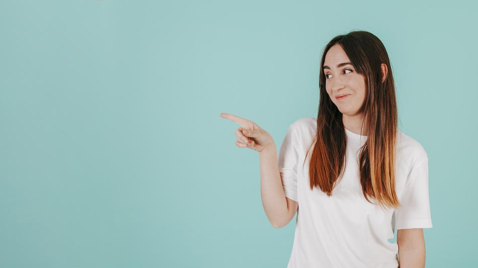 funny long hair Woman Pointing aside