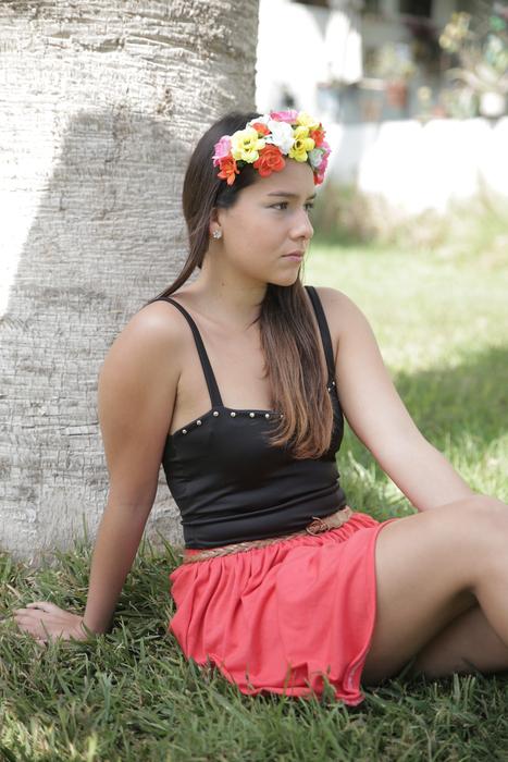 girl with flower wreath on the lawn