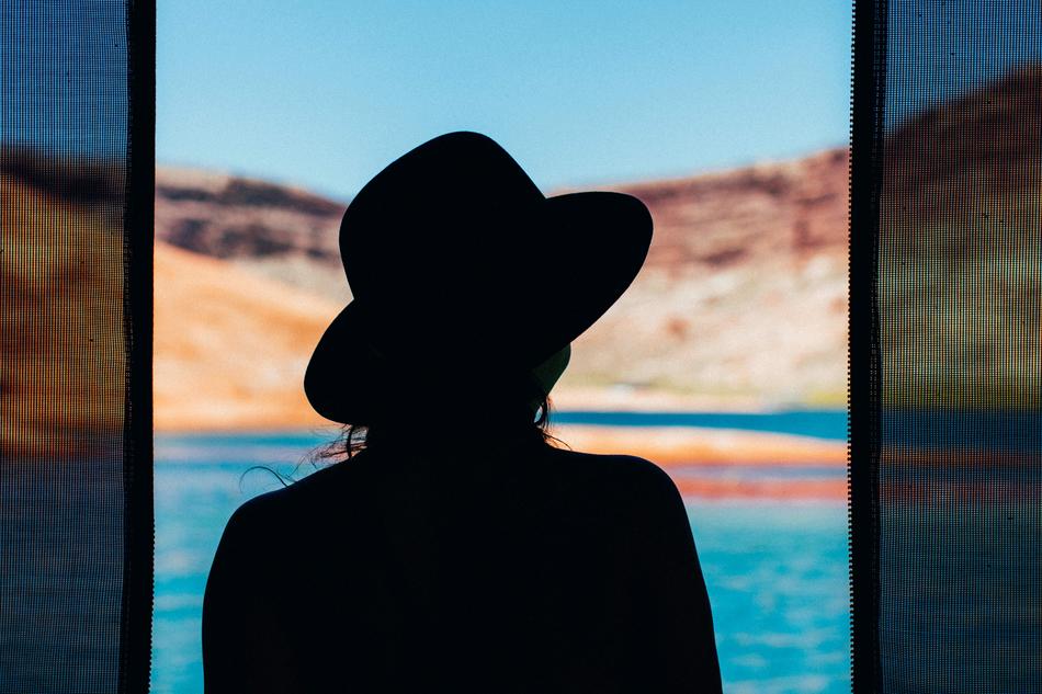 woman silhouette on the blue sea background