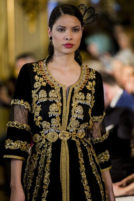 young girl in designer clothing on Arabfashion event