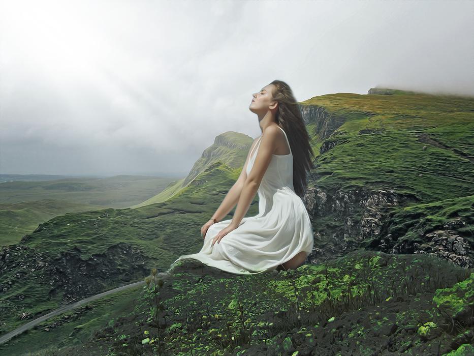woman in white sundress among green mountains