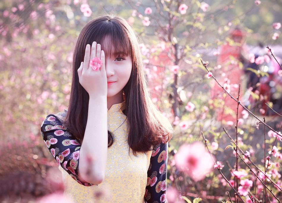 young Girl with hand on face outdoor