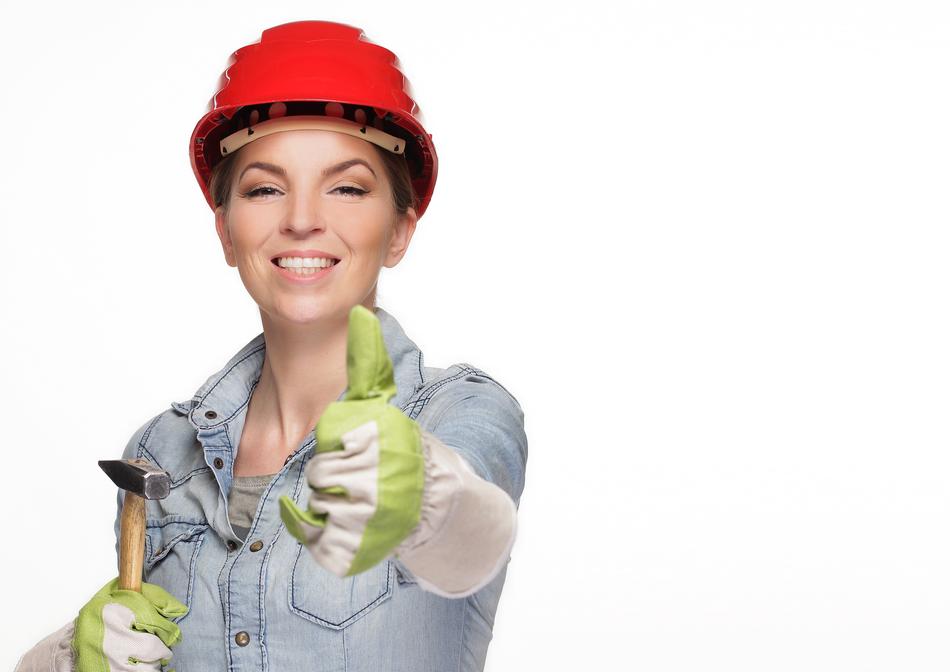 girl in a construction helmet and with tools in crayfish
