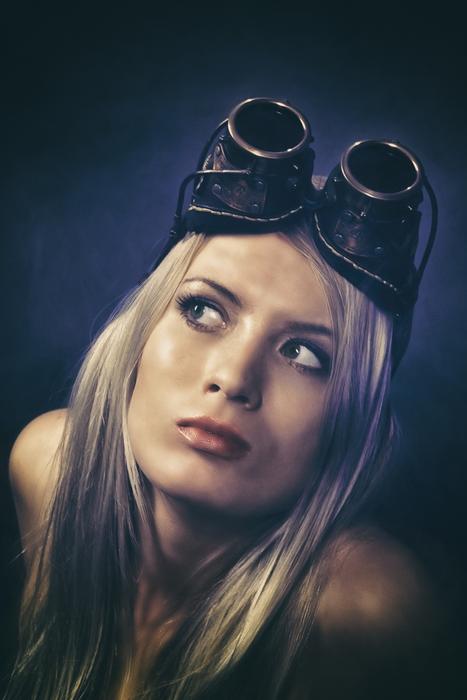 photo of blonde with welding glasses