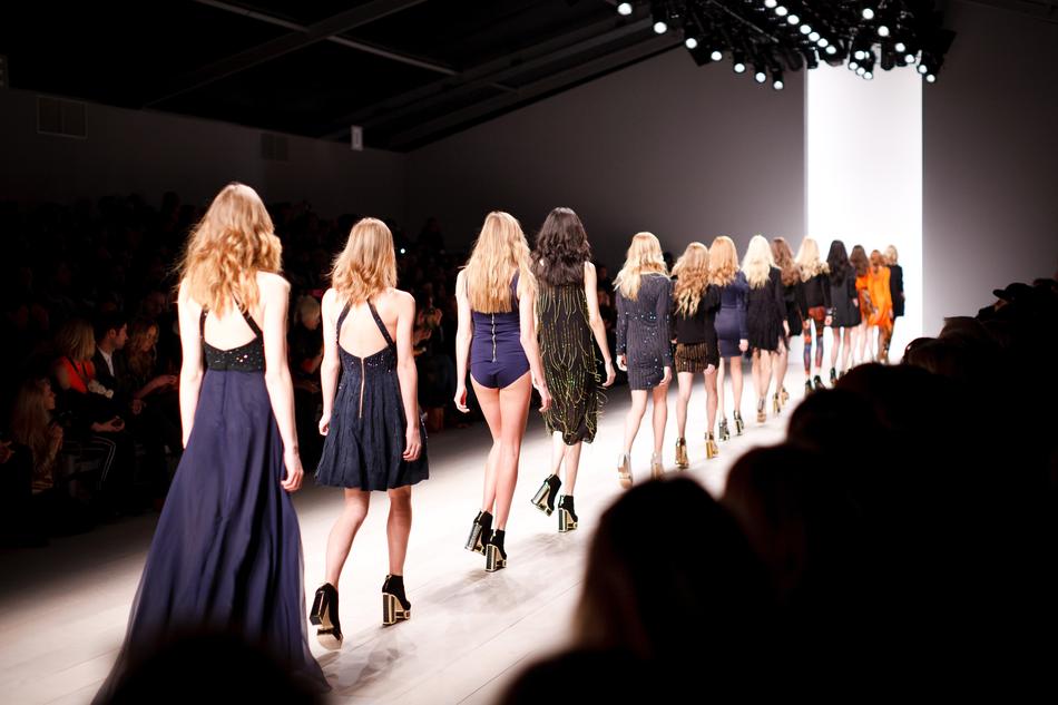 a group of models is on the catwalk