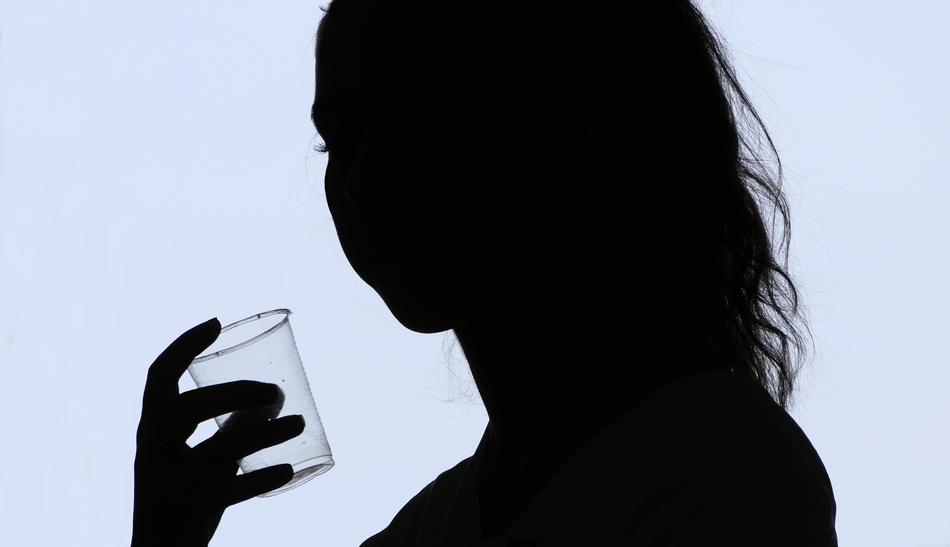 portrit of silhouette of a woman with glass