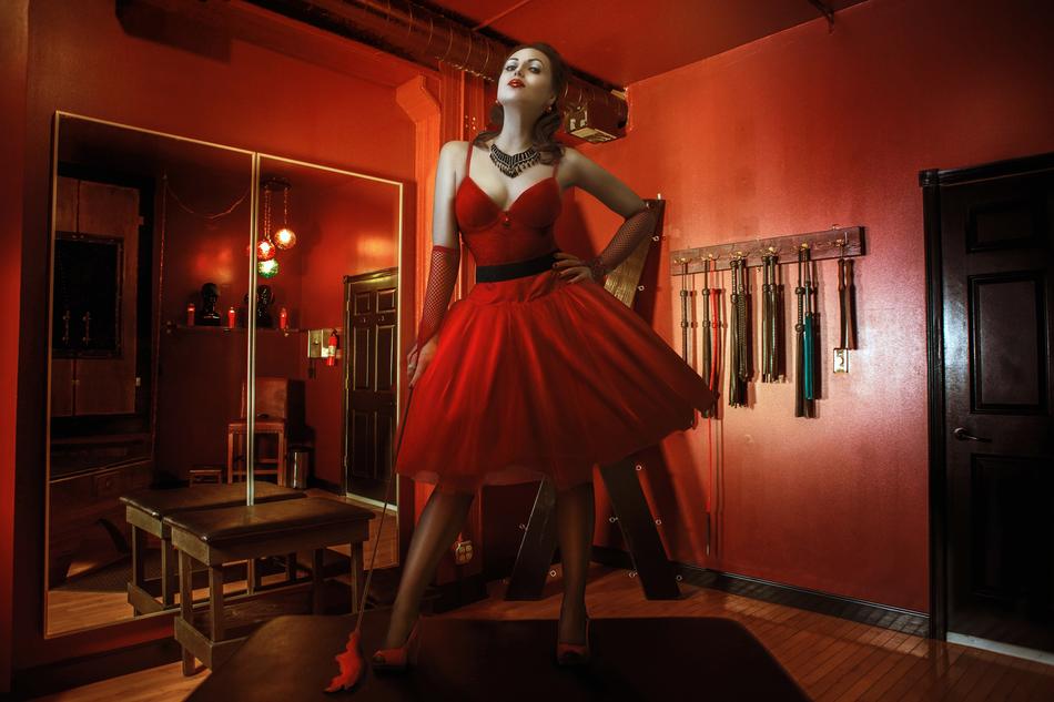 model in red dress in red room