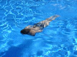 woman diving in the pool