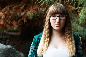 Portrait of Young girl in glasses outdoor