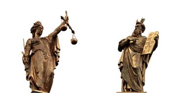 two bronze statues on the white background