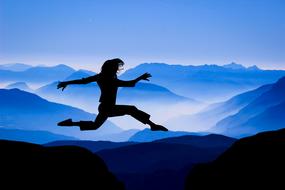 silhouette of Jumping Woman at mountains, drawing