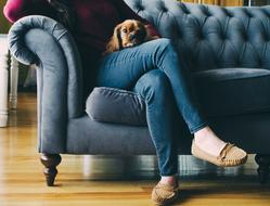 woman sitting on the couch in cozy shoes