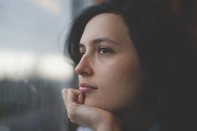 portrait of a girl in thought on a blurred background