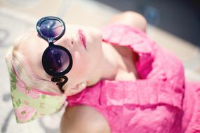 summer portrait of young woman in blurred background