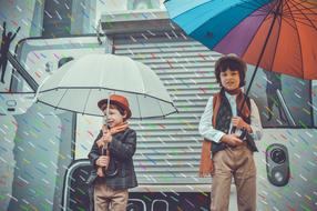 Kids under Rain Umbrellas