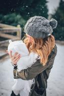 winter photo of a girl with a newborn