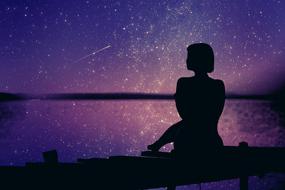 black female silhouette against purple sunset background