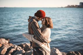 Happy young Couple hugging at sea