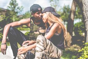 young afro american Couple in love sitting together outdoor