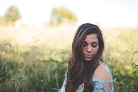 Beautiful teenager girl on the landscape with the field