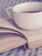 cup of tea on an open book