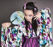 long haired Asian woman with fan in traditional clothe