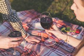 Celebration, young couple with wine in glasses outdoor