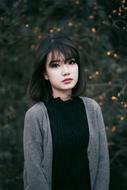 photo of a japanese girl in gray-black clothes