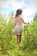 Woman Running on wildflowers Meadow