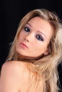 young blonde Girl turning her head, Portrait