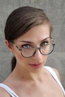 Portrait of the woman with glasses and earrings