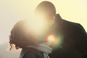 bright glow during a kiss of a couple in love