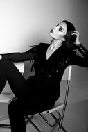 Black and white picture of a woman in black suit