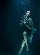 young girl with close eyes Underwater