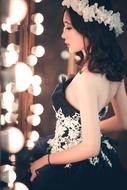 Beautiful Woman in black and wite dress, side view